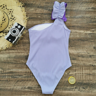 Black one-shoulder ribbed one-piece swimsuit with a ruffled blue and black strap, ideal for women's swimwear. - Image 62