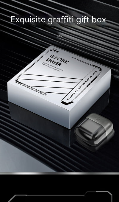 Silver mini electric shaver with a double-headed rotary design and a black power button on top. - Image 26