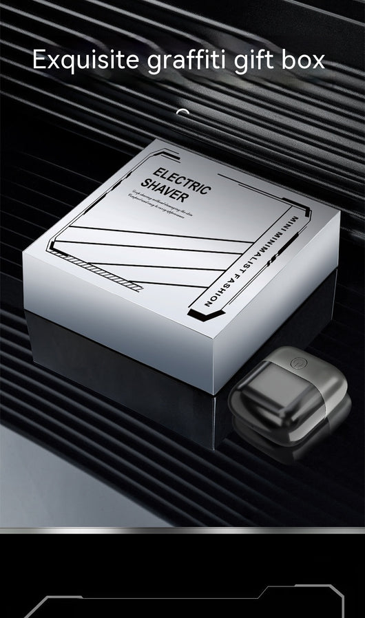 Silver mini electric shaver with a double-headed rotary design and a black power button on top. - Image 26