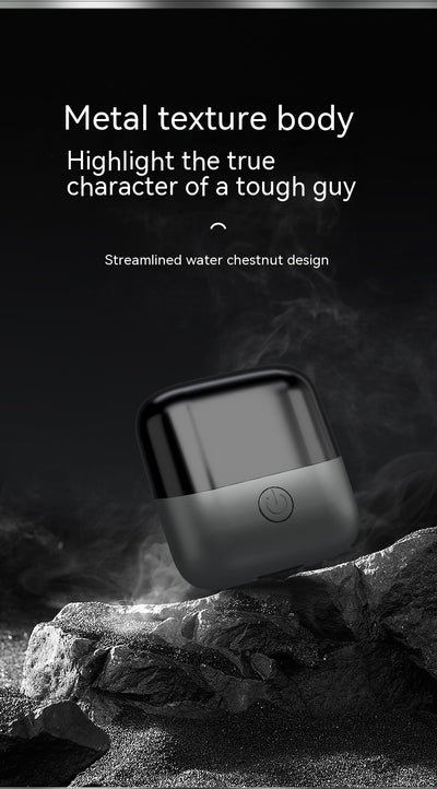 Silver mini electric shaver with a double-headed rotary design and a black power button on top. - Image 36