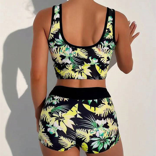 Two-piece swimsuit with a black background and vibrant pink and purple tropical floral print. Features a V-neck crop top and high-waisted boxer shorts. - Image 27