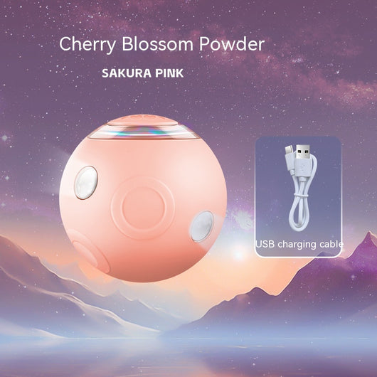 Sakura pink smart pet ball with automatic obstacle avoidance and luminous rotation, shown with its USB charging cable. - Image 10
