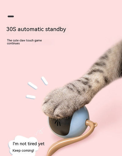 Yellow electric cat toy ball with a black face, glowing blue eyes and whiskers, and a grey tail attachment. - Image 7