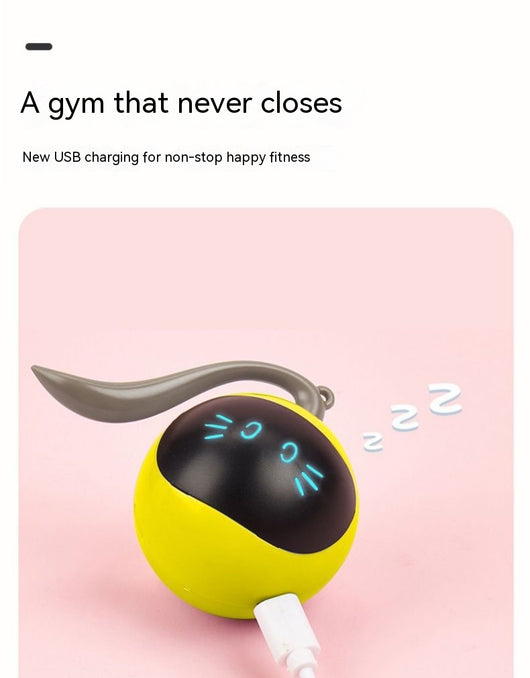 Yellow electric cat toy ball with a black face, glowing blue eyes and whiskers, and a grey tail attachment. - Image 13