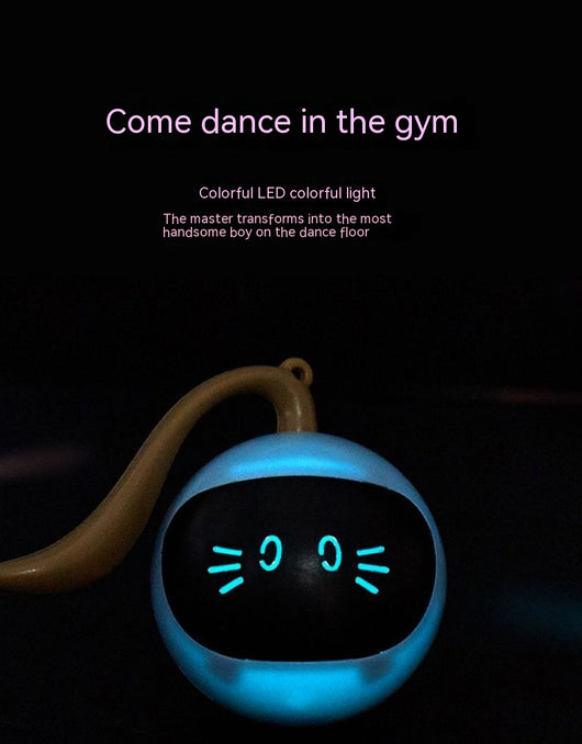 Yellow electric cat toy ball with a black face, glowing blue eyes and whiskers, and a grey tail attachment. - Image 15