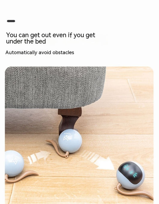 Yellow electric cat toy ball with a black face, glowing blue eyes and whiskers, and a grey tail attachment. - Image 17