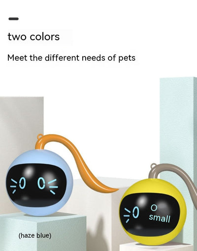 Yellow electric cat toy ball with a black face, glowing blue eyes and whiskers, and a grey tail attachment. - Image 29