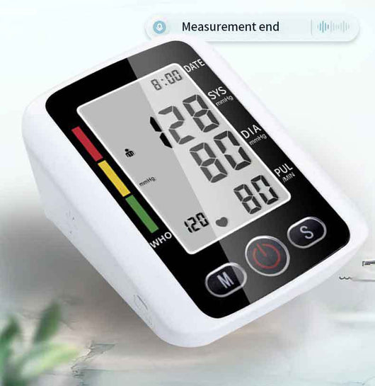 White electronic arm blood pressure monitor with large digital display and dark blue cuff, next to its product box. - Image 31