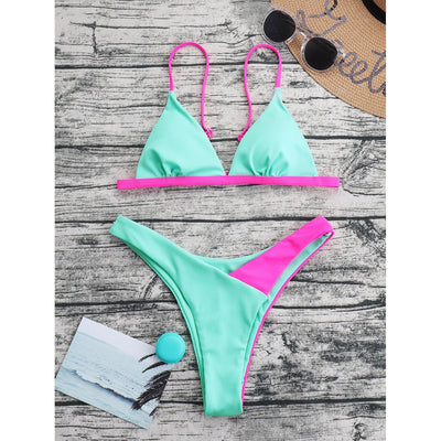 Mint green ribbed triangle bikini with hot pink trim and high-cut bottom, displayed on a wooden surface. - Image 15
