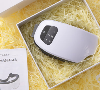 White Bluetooth music eye massager with control panel, air pressure, and hot compress functions in a gift box. - Image 40