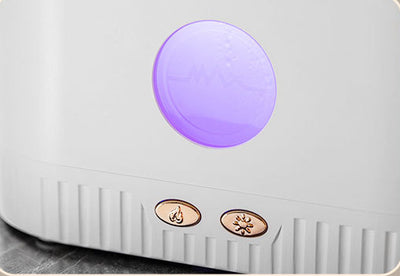 Black desktop humidifier with clear top filled with pink Himalayan salt rocks and rose gold control buttons. - Image 12