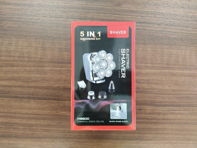 New digital electric shaver with eight rotary blades in a metallic silver finish, designed for a close shave. - Image 19