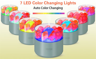 White cool-mist humidifier and aroma diffuser with glowing blue LED lights and orange crystal salt rocks, emitting mist. - Image 20