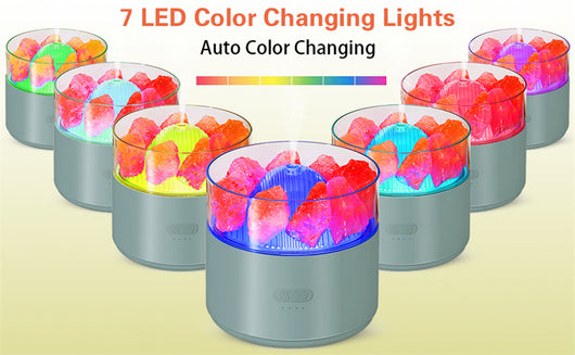 White cool-mist humidifier and aroma diffuser with glowing blue LED lights and orange crystal salt rocks, emitting mist. - Image 20