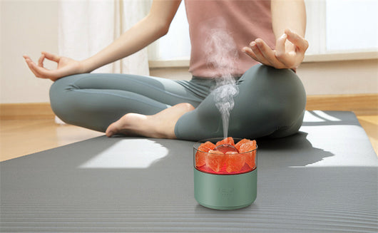White cool-mist humidifier and aroma diffuser with glowing blue LED lights and orange crystal salt rocks, emitting mist. - Image 21