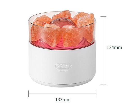 White cool-mist humidifier and aroma diffuser with glowing blue LED lights and orange crystal salt rocks, emitting mist. - Image 24