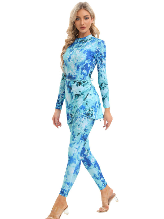 Blue tie-dye conservative beach swimsuit with long sleeves, full-length leggings, and a sheer sarong-style skirt. - Image 47