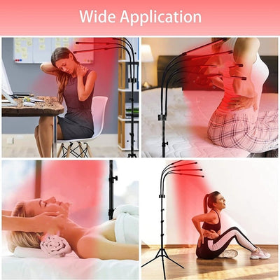 Red light therapy lamp with four adjustable arms illuminating a person lying on a white massage table. - Image 13