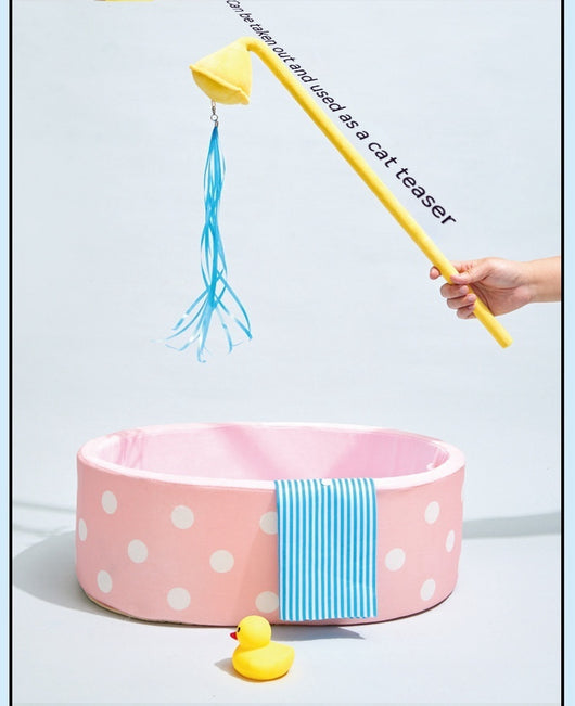 Pink polka dot pet bed shaped like a bathtub with a yellow showerhead toy and blue streamers, plus a blue striped 'towel'. - Image 10