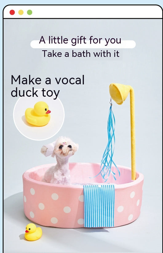 Pink polka dot pet bed shaped like a bathtub with a yellow showerhead toy and blue streamers, plus a blue striped 'towel'. - Image 16