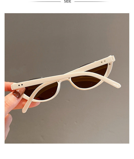 Pink cat-eye sunglasses with purple gradient lenses on a white background, showcasing a trendy style. - Image 23