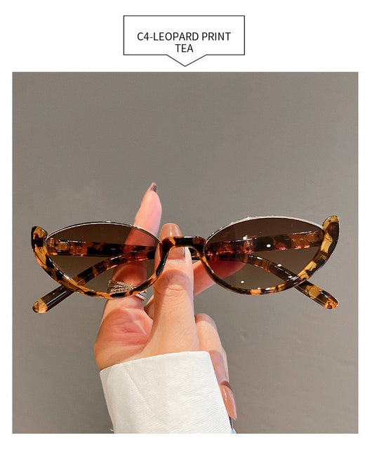 Pink cat-eye sunglasses with purple gradient lenses on a white background, showcasing a trendy style. - Image 24