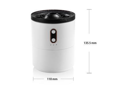 White volcanic flame aroma essential oil diffuser emitting orange light and mist on a wooden desk next to a laptop. - Image 10