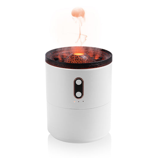 White volcanic flame aroma essential oil diffuser emitting orange light and mist on a wooden desk next to a laptop. - Image 14