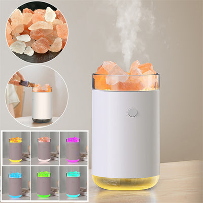 Pink cylindrical humidifier and essential oil diffuser with glowing orange crystal salt stones and a clear base. - Image 13