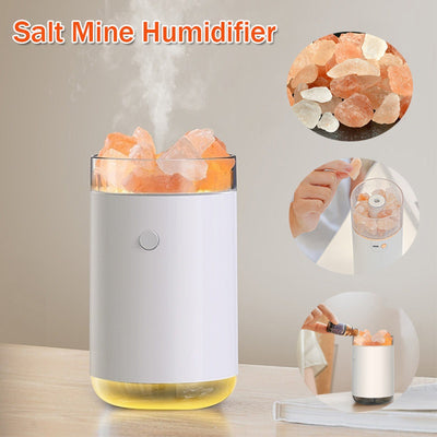 Pink cylindrical humidifier and essential oil diffuser with glowing orange crystal salt stones and a clear base. - Image 15