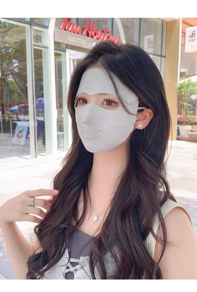 Light blue ice silk face mask with breathable perforations and adjustable ear loops for sun protection. - Image 34