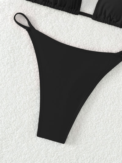Red triangle cup halter bikini swimsuit for women on a sandy beach with ocean waves in the background. - Image 13