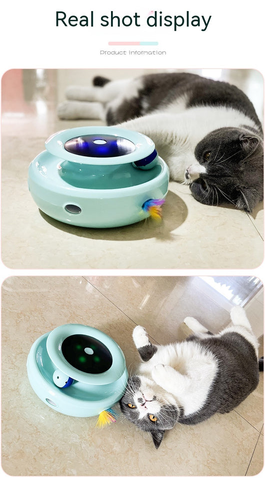 Grey and white cat observing a blue electric cat toy with a feather attachment and glowing blue lights. - Image 12