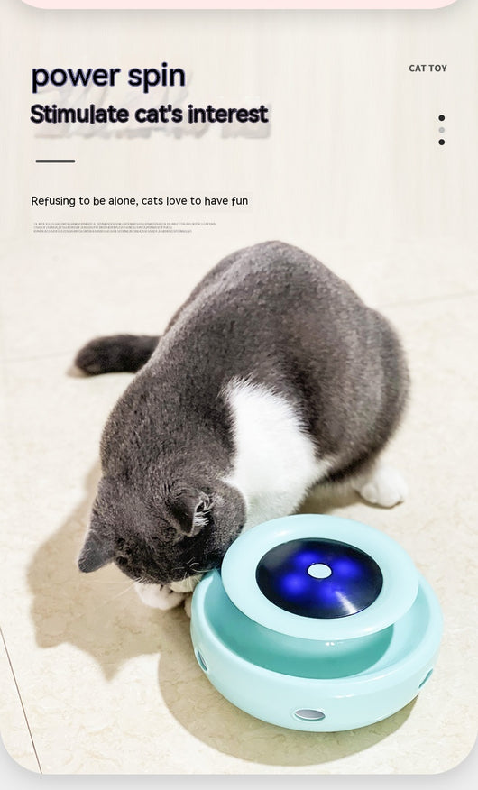 Grey and white cat observing a blue electric cat toy with a feather attachment and glowing blue lights. - Image 13
