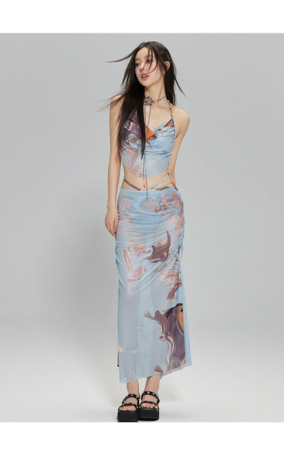 Light blue abstract print two-piece bikini set with a cropped halter top featuring chain straps and a ruched maxi skirt. - Image 11