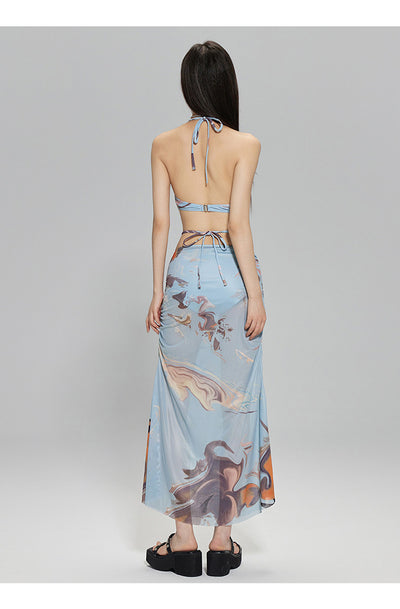 Light blue abstract print two-piece bikini set with a cropped halter top featuring chain straps and a ruched maxi skirt. - Image 14