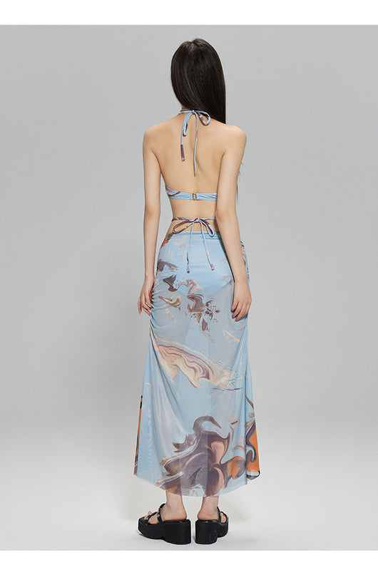 Light blue abstract print two-piece bikini set with a cropped halter top featuring chain straps and a ruched maxi skirt. - Image 14