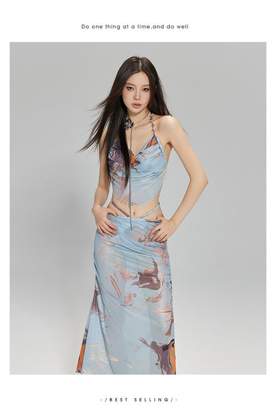 Light blue abstract print two-piece bikini set with a cropped halter top featuring chain straps and a ruched maxi skirt. - Image 16