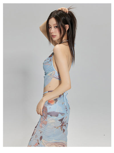 Light blue abstract print two-piece bikini set with a cropped halter top featuring chain straps and a ruched maxi skirt. - Image 20