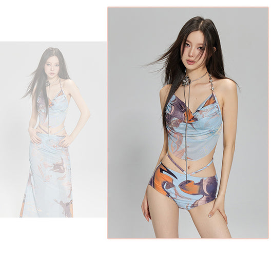 Light blue abstract print two-piece bikini set with a cropped halter top featuring chain straps and a ruched maxi skirt. - Image 21