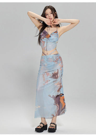 Light blue abstract print two-piece bikini set with a cropped halter top featuring chain straps and a ruched maxi skirt. - Image 24