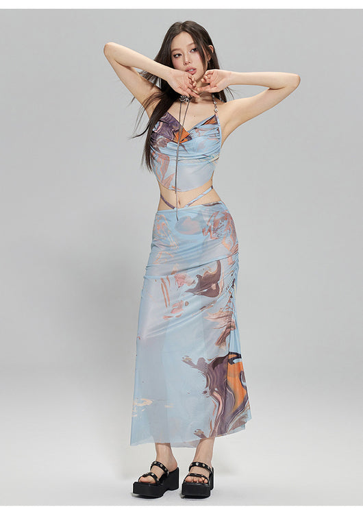 Light blue abstract print two-piece bikini set with a cropped halter top featuring chain straps and a ruched maxi skirt. - Image 24