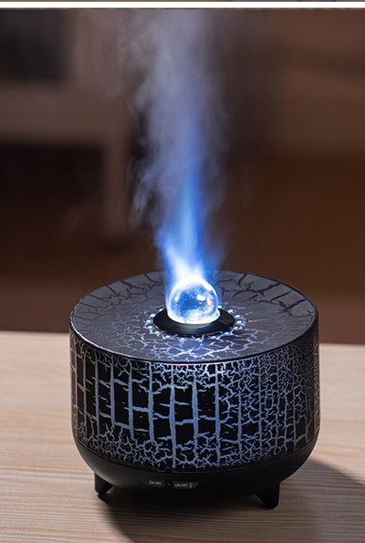 Black cylindrical aromatherapy diffuser with a crackle pattern, clear spherical top, and control buttons for timer and light. - Image 4