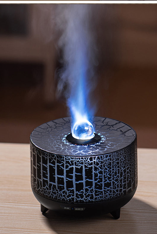 Black cylindrical aromatherapy diffuser with a crackle pattern, clear spherical top, and control buttons for timer and light. - Image 4