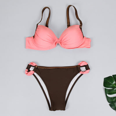 Women's two-piece swimsuit with a pink pleated bandeau top and brown bikini bottoms with pink accents, by the ocean. - Image 37