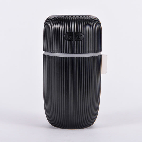 Black ribbed white noise humidifier with control buttons on top, designed to aid sleep and humidify. - Image 11