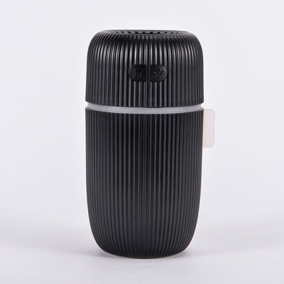 Black ribbed white noise humidifier with control buttons on top, designed to aid sleep and humidify. - Image 11