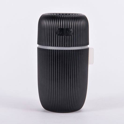 Black ribbed white noise humidifier with control buttons on top, designed to aid sleep and humidify. - Image 11