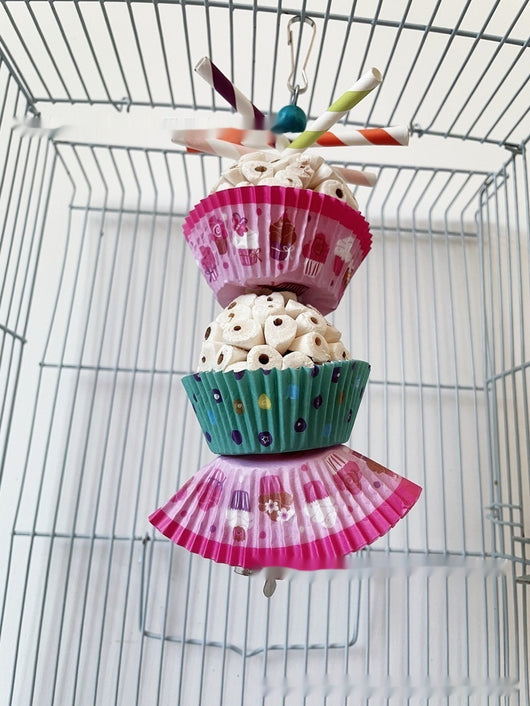 Two parrot shredding toys, shaped like cupcakes with paper straws, featuring colorful paper cups and a metal clasp. - Image 24