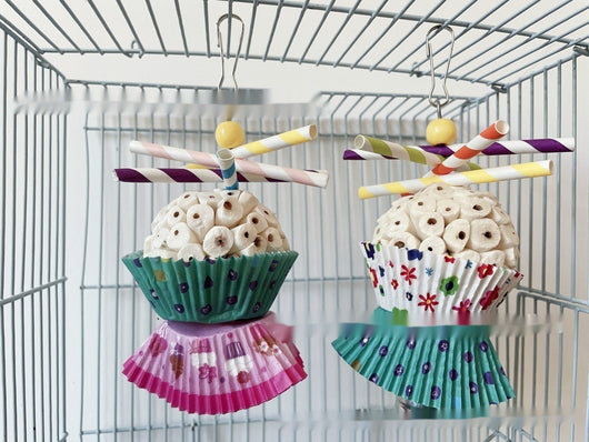 Two parrot shredding toys, shaped like cupcakes with paper straws, featuring colorful paper cups and a metal clasp. - Image 32